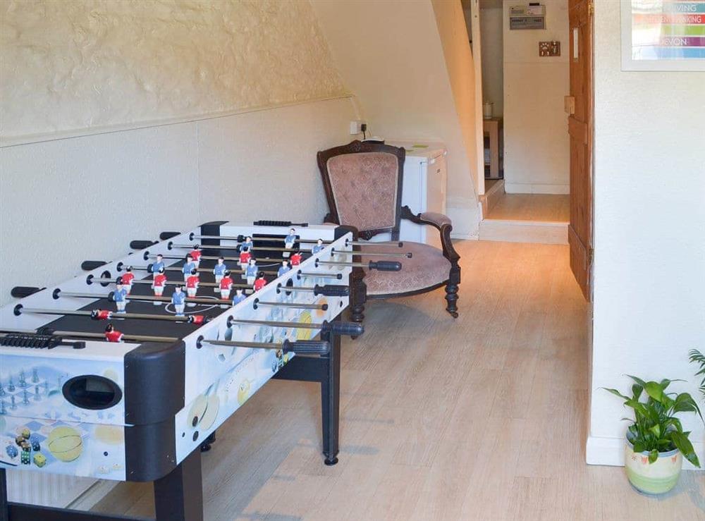 Games room with table football and darts at Lavender Cottage in Buckfastleigh, Devon