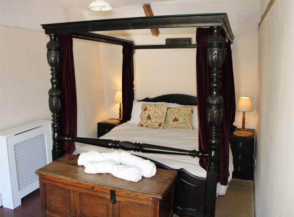 Four Poster bedroom at Lavender Cottage in Methwold, near Thetford, Norfolk