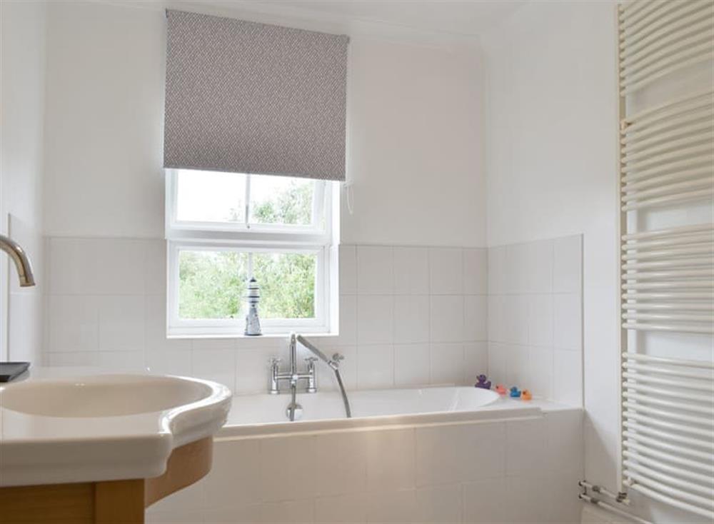 Family bathroom with bath and separate shower enclosure at Lavender Cottage in Winterton-on-Sea, near Great Yarmouth, Norfolk