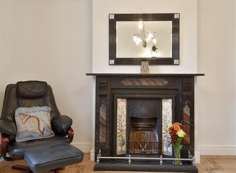 Feature fireplace within the living room at Lavender Cottage in Winterton-on-Sea, near Great Yarmouth, Norfolk