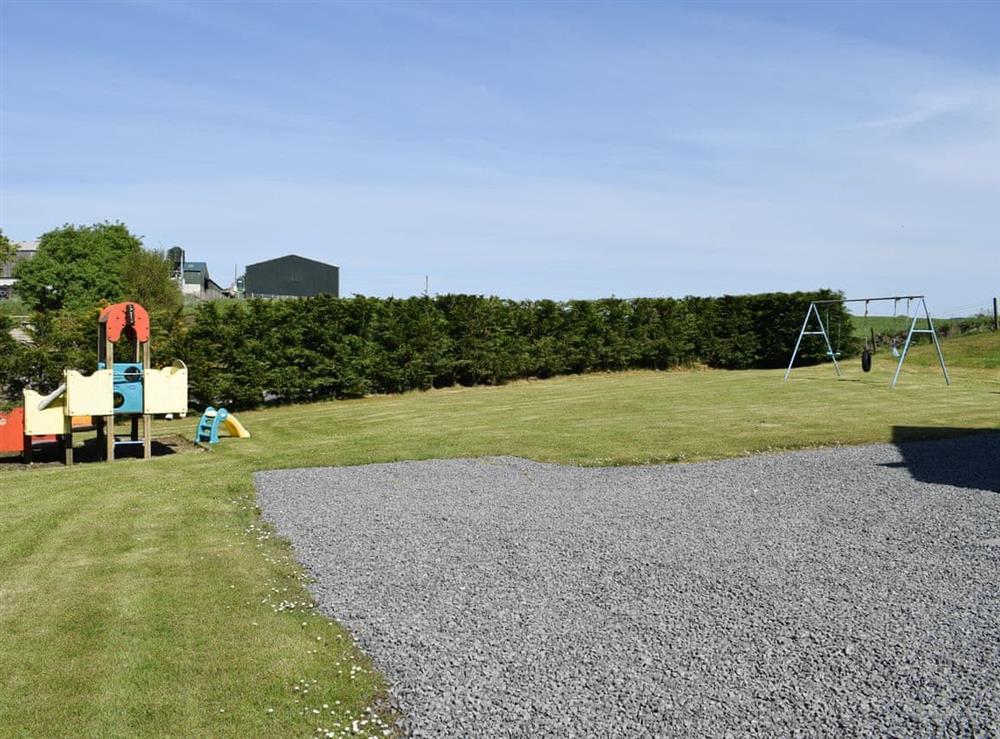 Garden with children’s play area at Lawford Lodge in Bonnybridge, near Falkirk, Stirlingshire