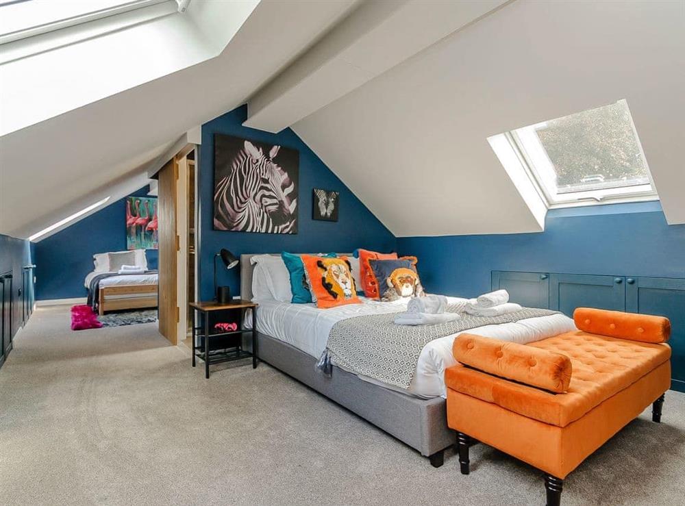 Colourful bedroom with walkway to twin bedroom (photo 3) at Lawnswood in Brompton-by-Sawdon, North Yorkshire