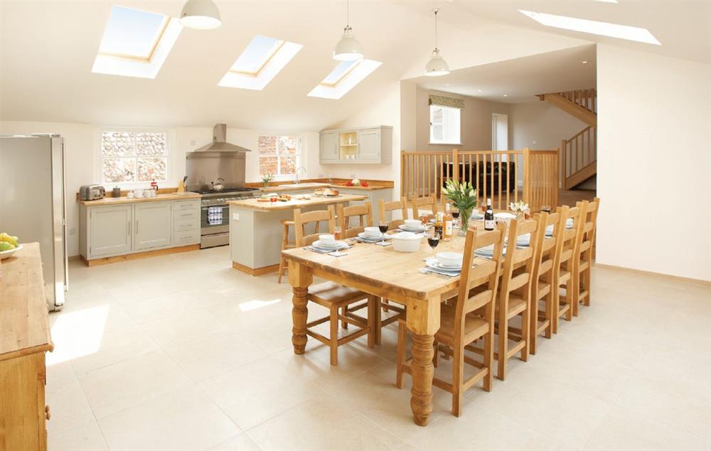 Large barn style kitchen/dining room with large doors to open outside to patio and back garden at Laylands, Wells-next-the-Sea