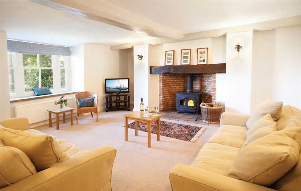 Sitting room with wood burning stove at Laylands, Wells-next-the-Sea