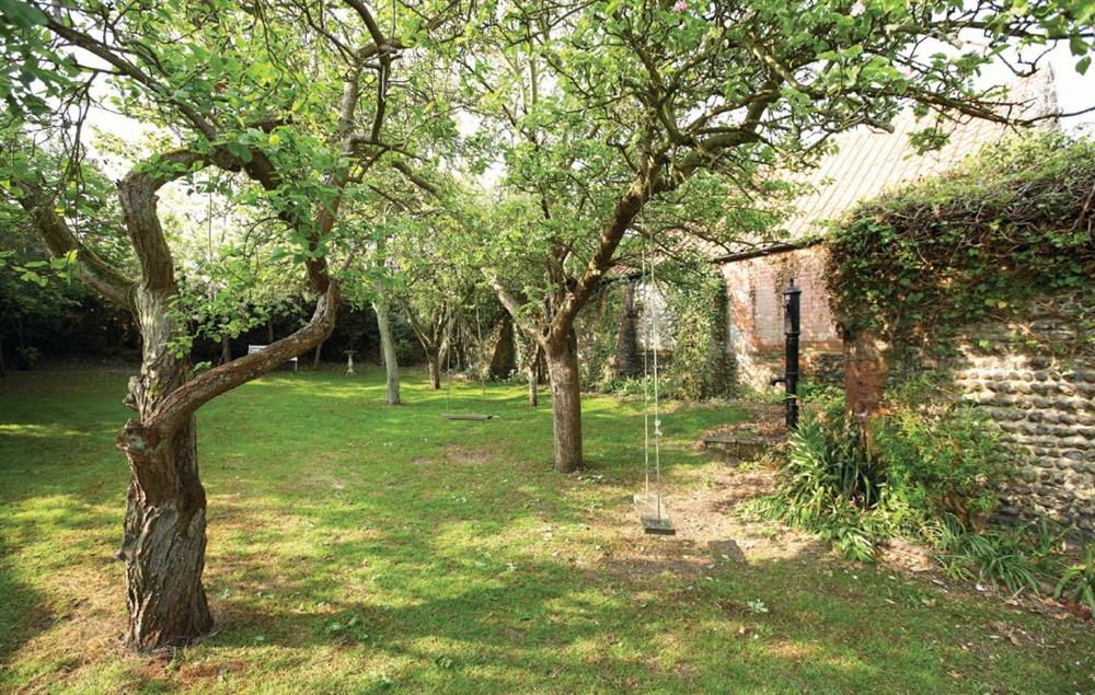 The large rear garden, which is walled and south facing, has mature fruit trees and a large patio, perfect for outside dining