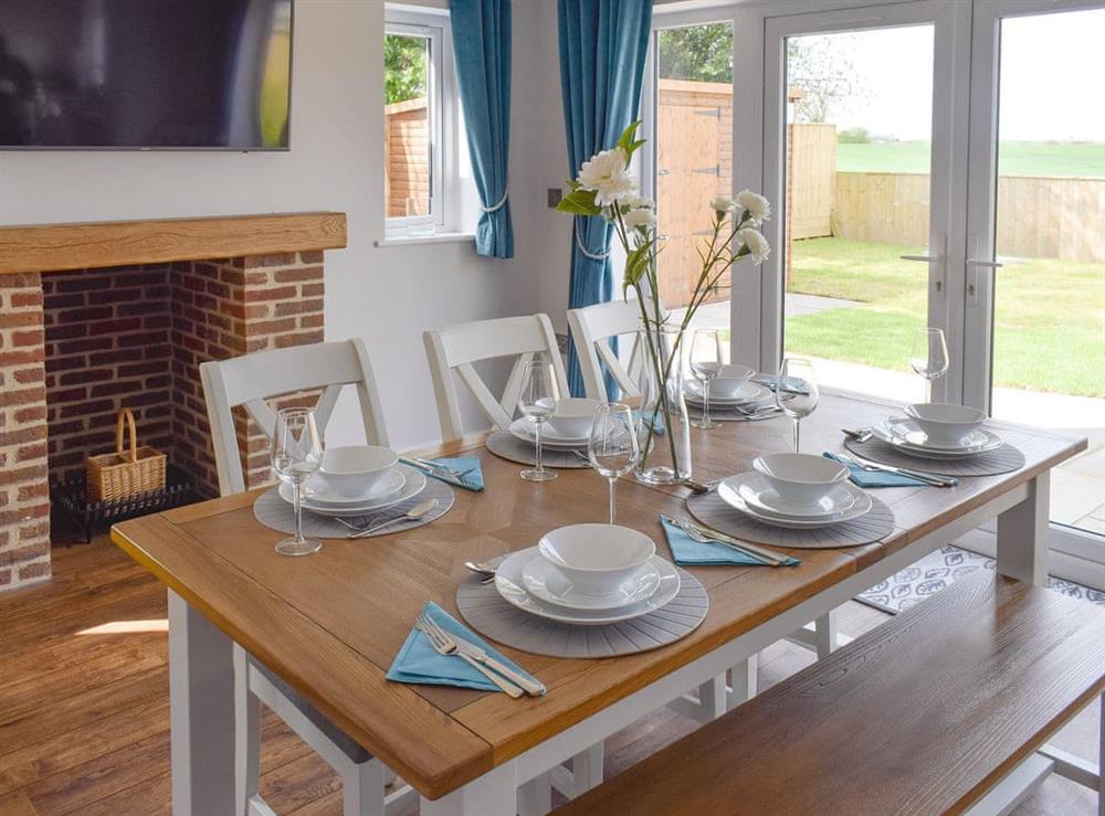 Airy dining space with French doors to garden at Lazenby in Danby Wiske, near Northallerton, North Yorkshire