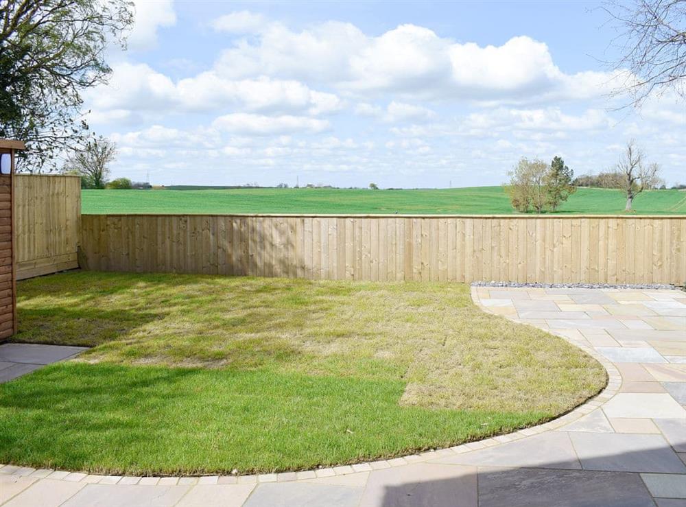 Enclosed rear garden and patio with exceptional rural views at Lazenby in Danby Wiske, near Northallerton, North Yorkshire