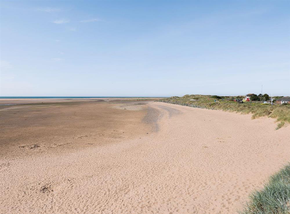 Wide expansive sandy beaches are within walking distance at Lazy Cottage in Haverigg, near Millom, Cumbria