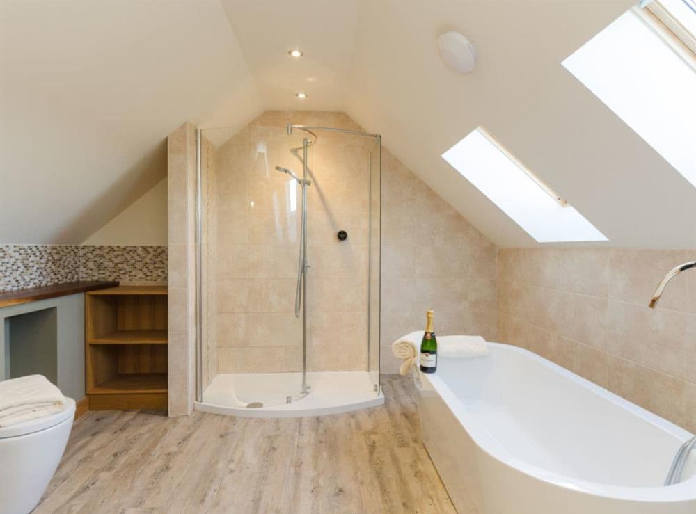 Family bathroom with separate shower at Tawny Cottage, 