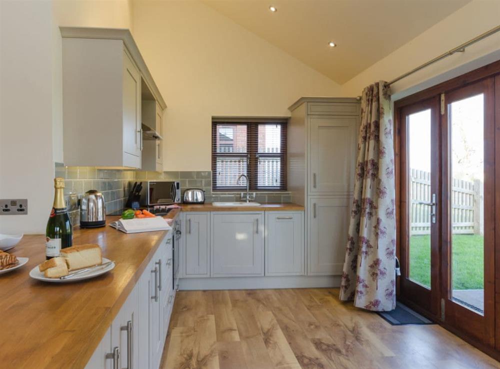 Well equipped kitchen at Tawny Cottage, 