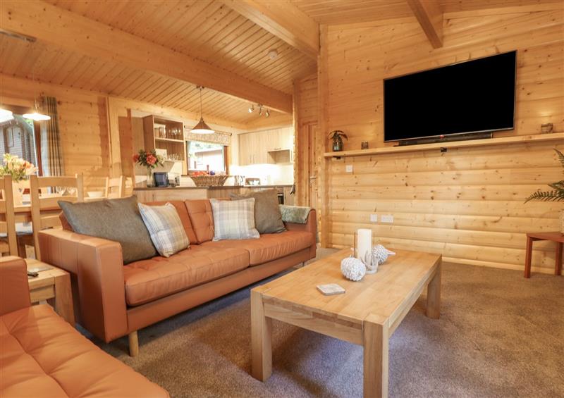 Relax in the living area at Leafy Hollow Lodge, Louth