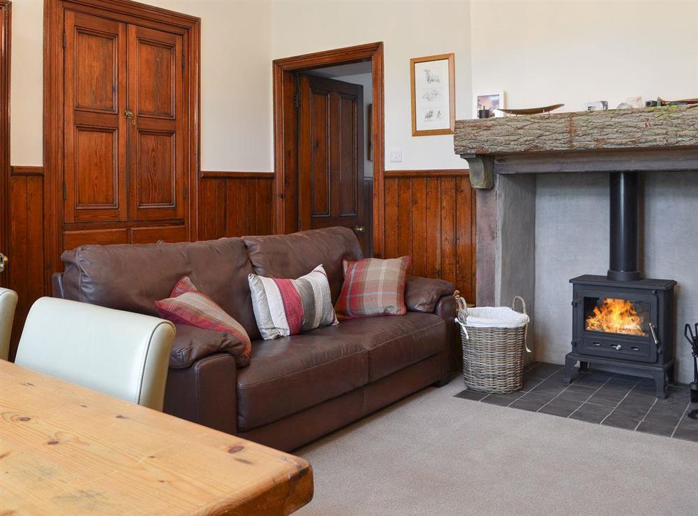 Living room with wood burner at Lealholme in Bassenthwaite, near Keswick, Cumbria