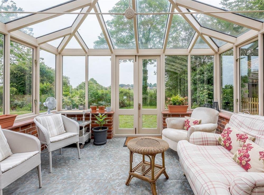 Light and airy conservatory at Leatherpool Place in Wiveton, near Holt, Norfolk