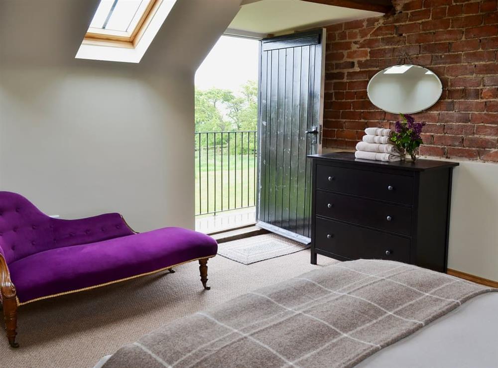 Cosy and romantic double bedroom with balcony at Mullins Cottage, 
