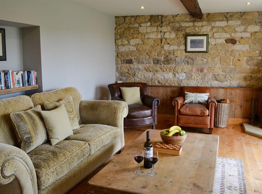 Cosy living room with wood burner (photo 2) at Mullins Cottage, 