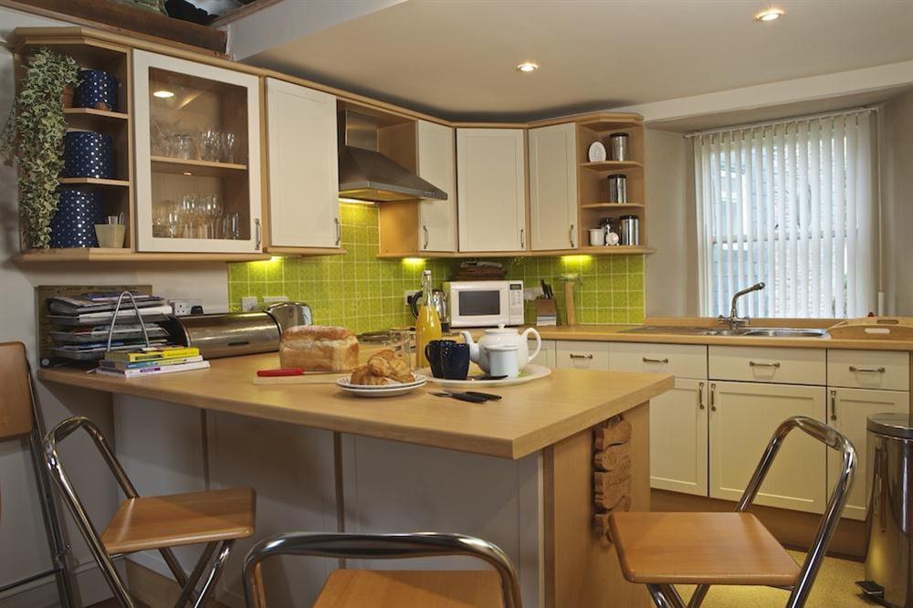 Kitchen area with a dining bar at Lee Shore in 88 Fore Street, Salcombe