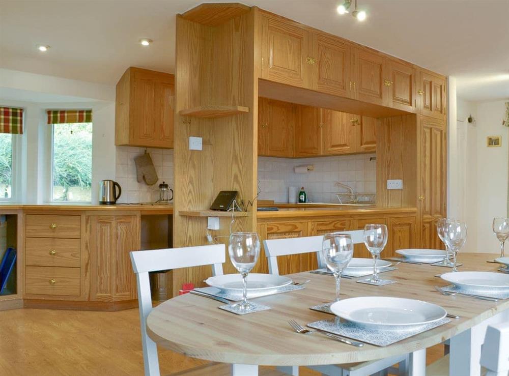 Extensive fitted kitchen with convenient dining area at Leyfield Coach House in Kirkby Lonsdale, Cumbria