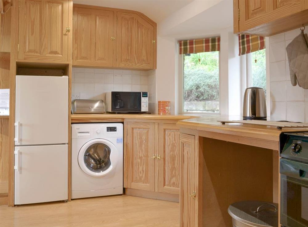 Well-equipped fitted kitchen at Leyfield Coach House in Kirkby Lonsdale, Cumbria