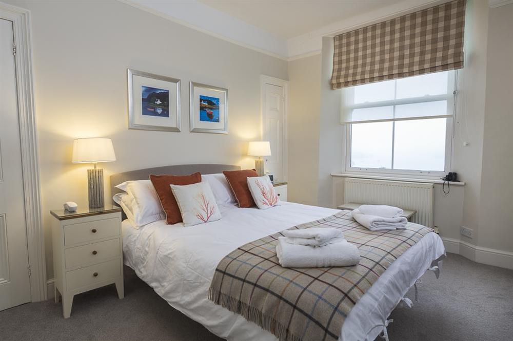 Master bedroom with King-size bed, en suite bathroom and views towards the harbour at Leylands in Allenhayes Road, Salcombe