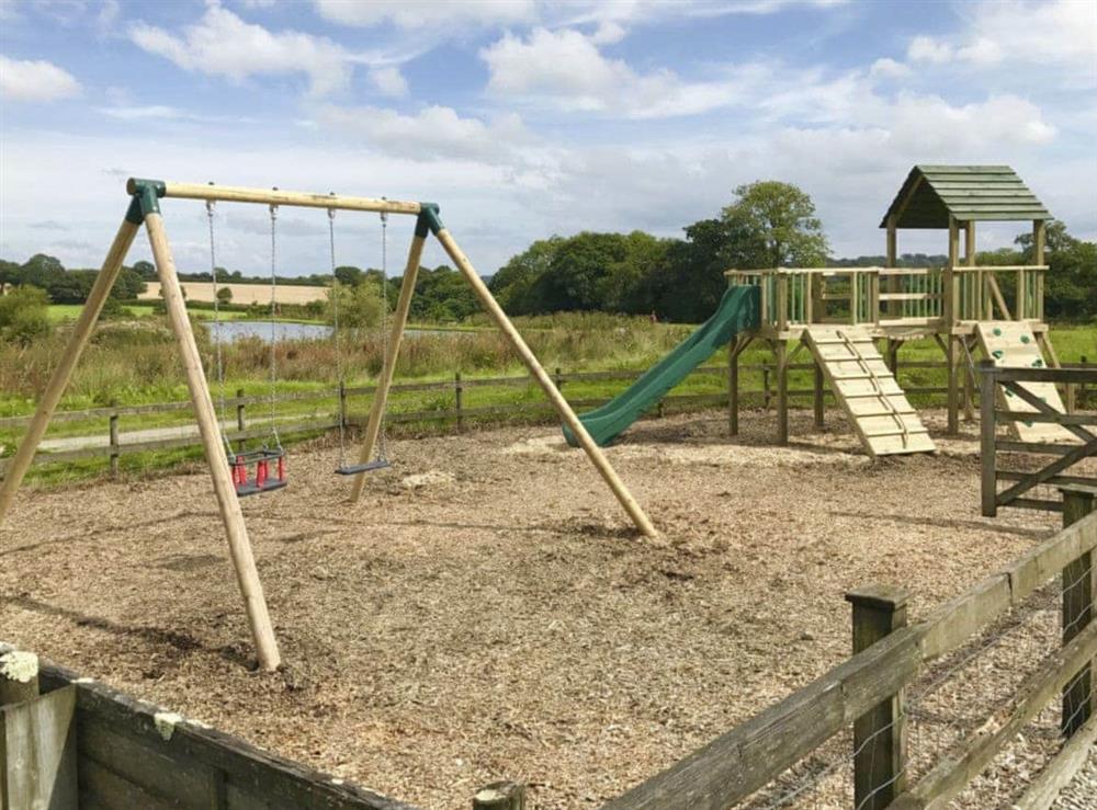 Enclosed children’s play area at Mole End, 