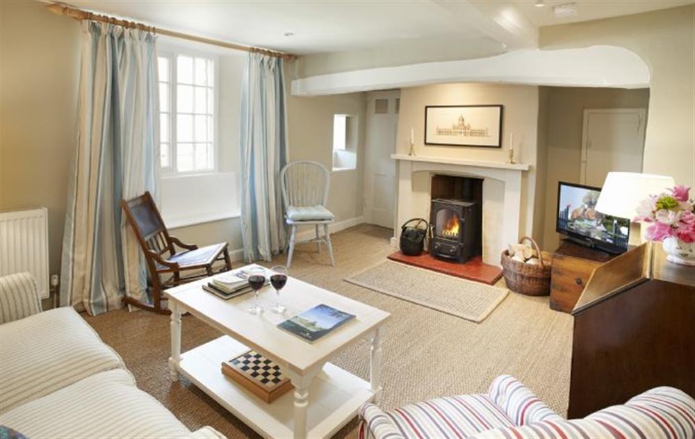 Large sitting room with wood burning stove. Furnished with vintage pieces from Castle Howard itself and carefully chosen modern furnishings, the cottage is perfectly appointed