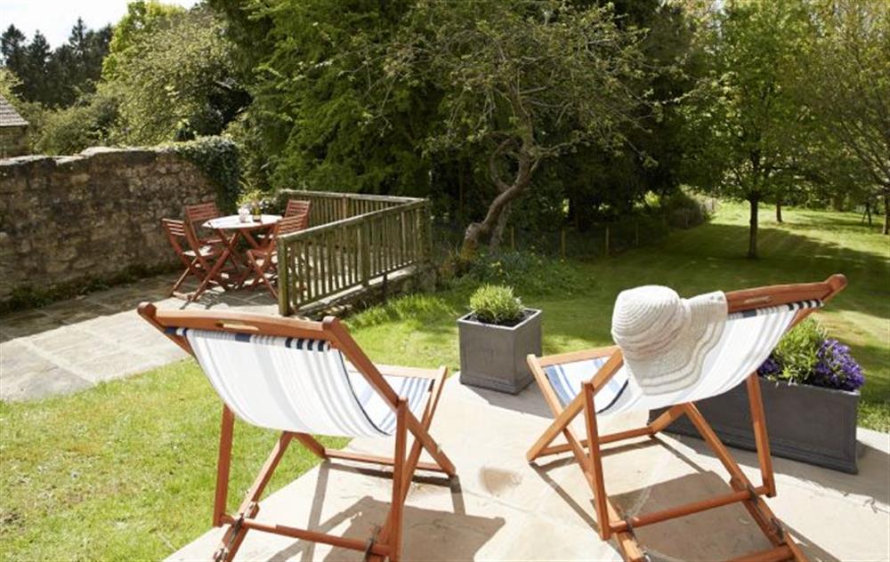 Relax in the deck chairs, over looking the sun drenched, spacious garden at Librarians Cottage, Coneysthorpe