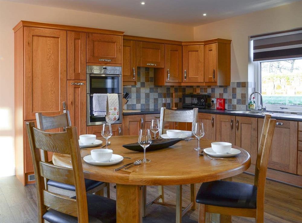 Kitchen with dining area at Liftingstane Cottage in Closeburn, near Thornhill, Dumfriesshire