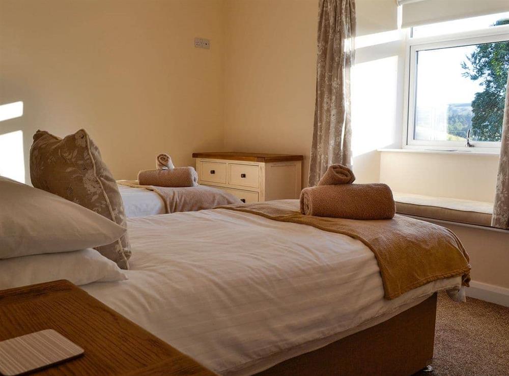 Comfortable twin bedded room at Liftingstane Dairy Cottage, 