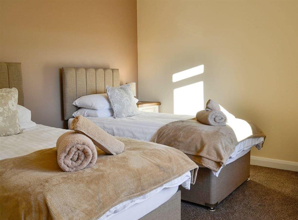 Well-appointed twin bedroom at Liftingstane Dairy Cottage, 