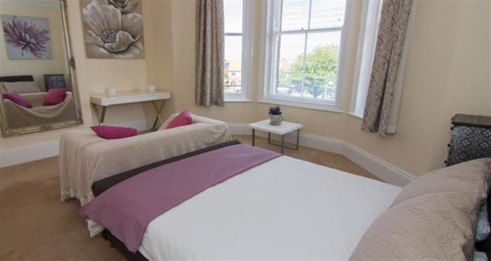 First floor:  Bedroom with double bed and lovely bay window at Lighthouse View, Cromer