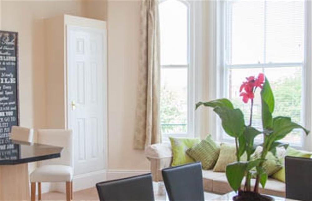 First floor:  Dining area looking towards bay window at Lighthouse View, Cromer