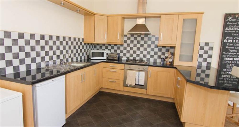 First floor:  Kitchen area with electric oven and gas hob at Lighthouse View, Cromer