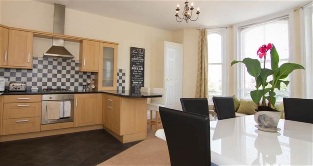 First floor:  Open plan living area with feature kitchen area at Lighthouse View, Cromer