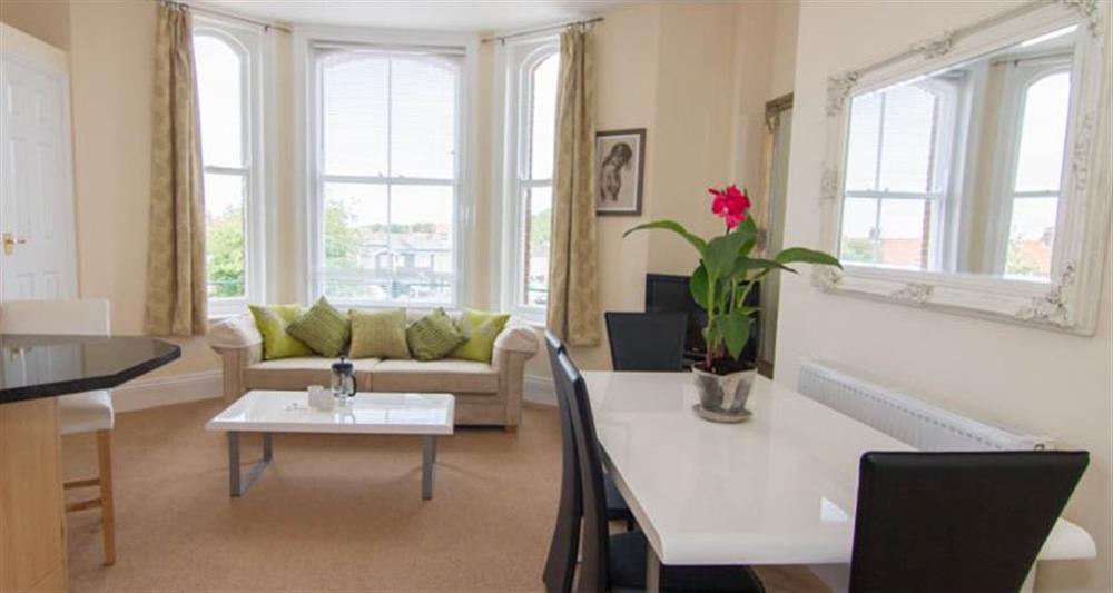 First floor:  Open plan living area with lovely bay window at Lighthouse View, Cromer