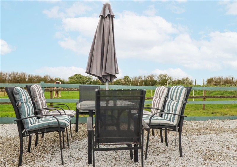 Enjoy a glass of wine on the patio at Likely Sunset, Newquay