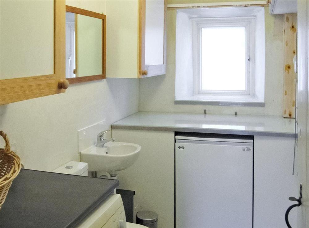 Convenient utility room at Lilac Cottage in Sedbusk, near Hawes, North Yorkshire