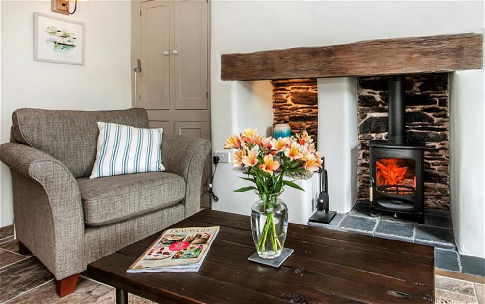 Nestle down by the log burner on those cooler evenings. at Lilac Cottage in South Pool