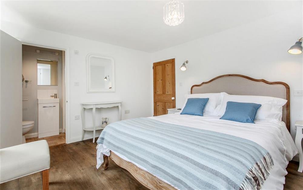 The elegant master bedroom with en-suite shower room. at Lilac Cottage in South Pool