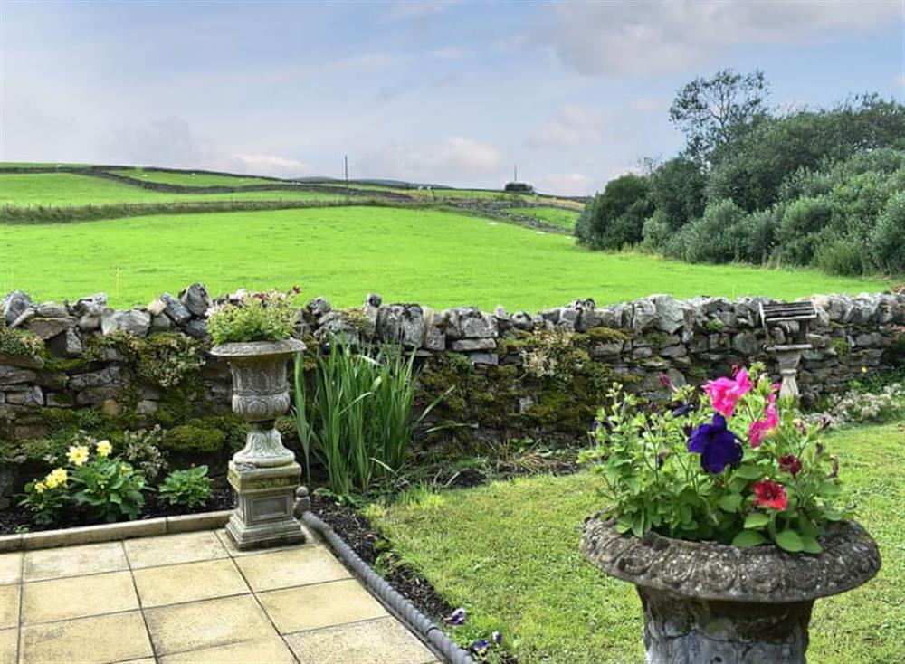 Paved patio area at Lilac Cottage in Westgate, near Bishop Auckland, Durham