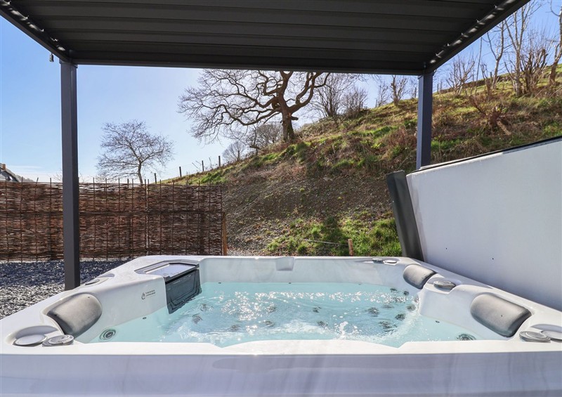 Enjoy the hot tub at Lili Wen Fach, near Ruthin