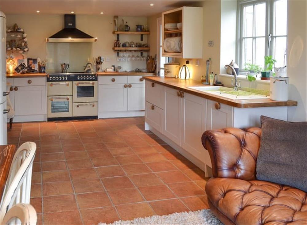 Kitchen with dining area & sofa at Lillipit Cottage in Breage, near Helston, Cornwall