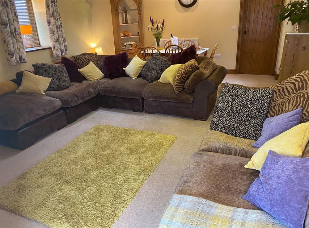 Living room/dining room at Lily Rose Cottage in Gilsland, near Brampton, Cumbria