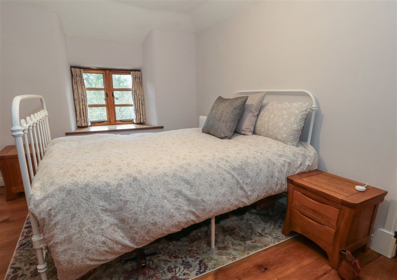 A bedroom in Limberlost Cottage (photo 2) at Limberlost Cottage, near Hamworthy