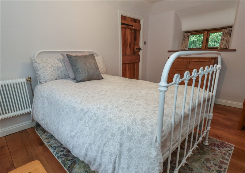 A bedroom in Limberlost Cottage (photo 3) at Limberlost Cottage, near Hamworthy