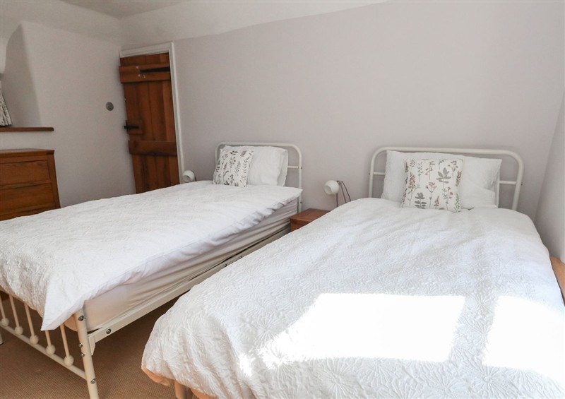 A bedroom in Limberlost Cottage at Limberlost Cottage, near Hamworthy