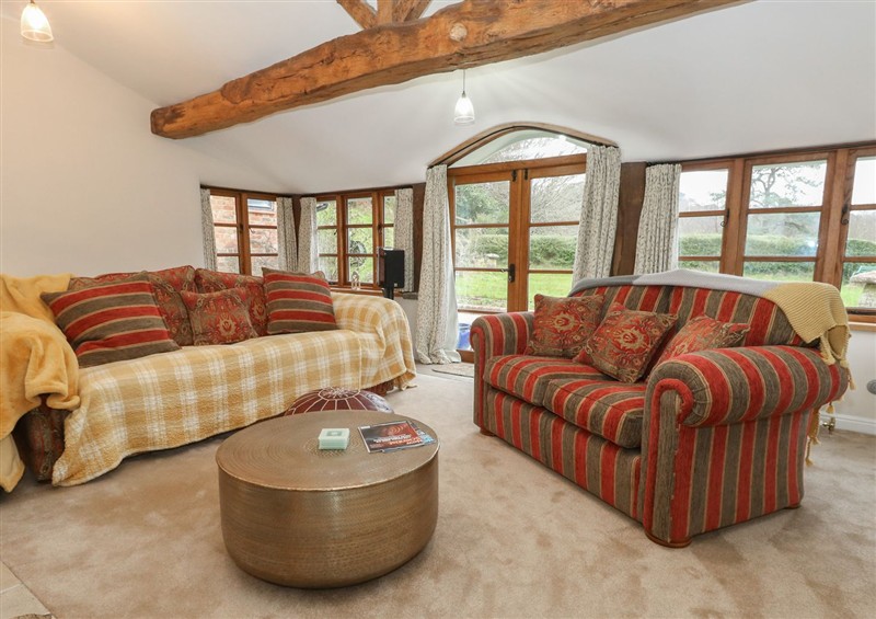 Relax in the living area at Limberlost Cottage, near Hamworthy