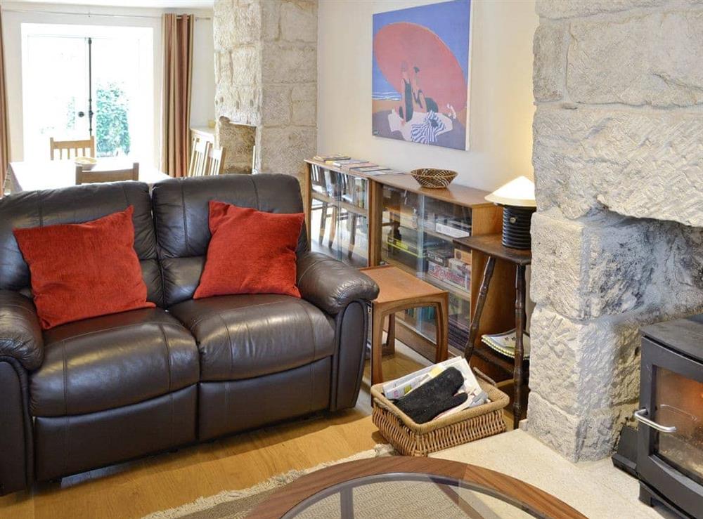 Open-aspect living and dining room at Lime Cottage in Portland, near Weymouth, Dorset