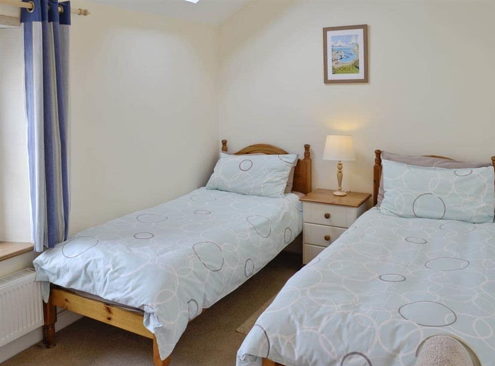 Relaxing twin bedroom at Lime Cottage in Portland, near Weymouth, Dorset