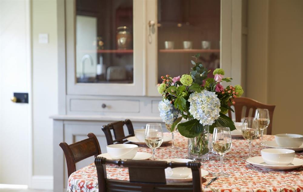 Enjoy supper and a glass of wine in the farmhouse kitchen table seats six guests at Lime Kiln Farmhouse, Coneysthorpe