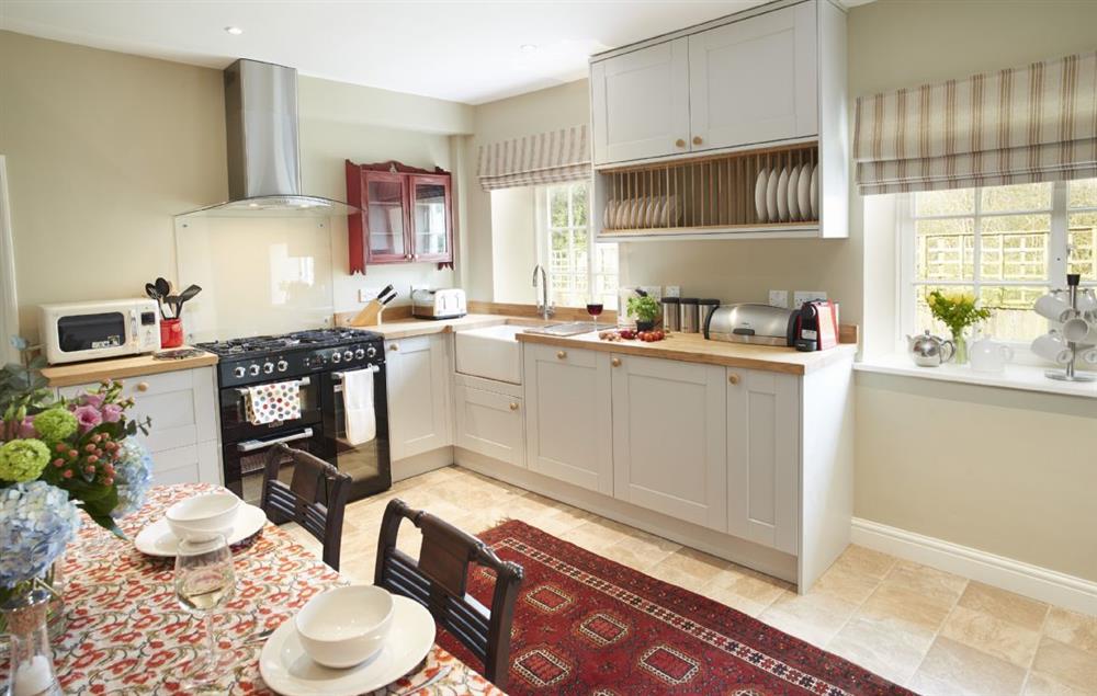 Farmhouse kitchen with range cooker and belfast sink at Lime Kiln Farmhouse, Coneysthorpe
